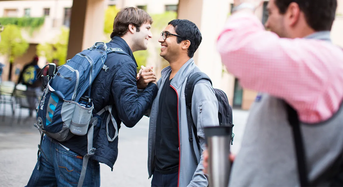 Students greeting each other in Town Square