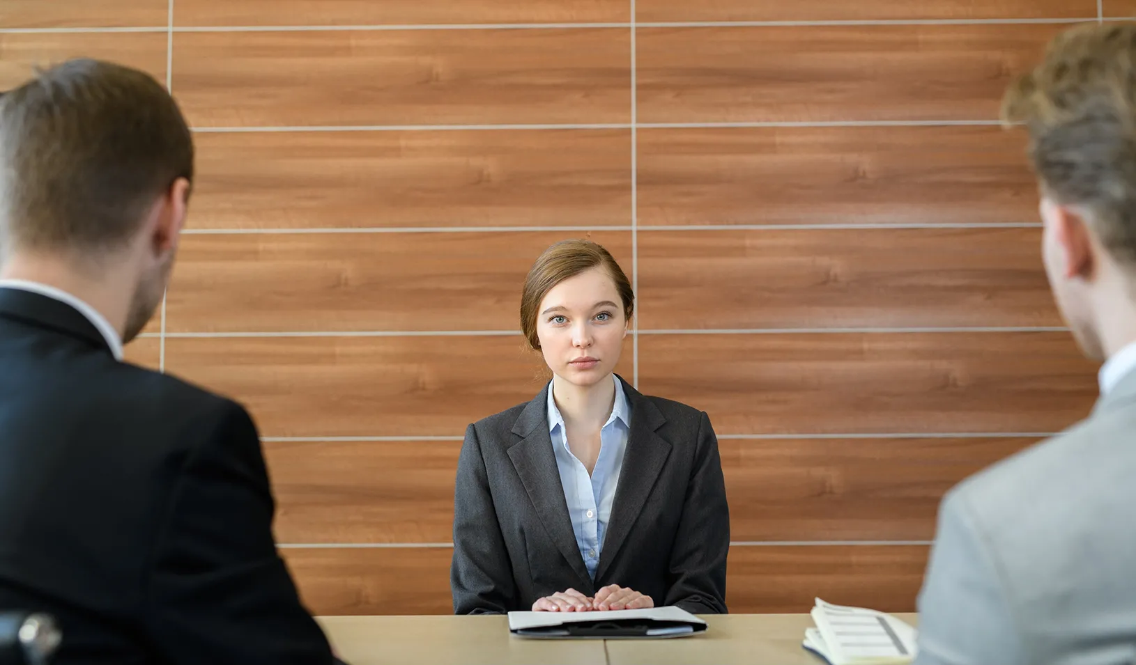 Woman in a business meeting with two men. Credit: iStock/mediaphotos