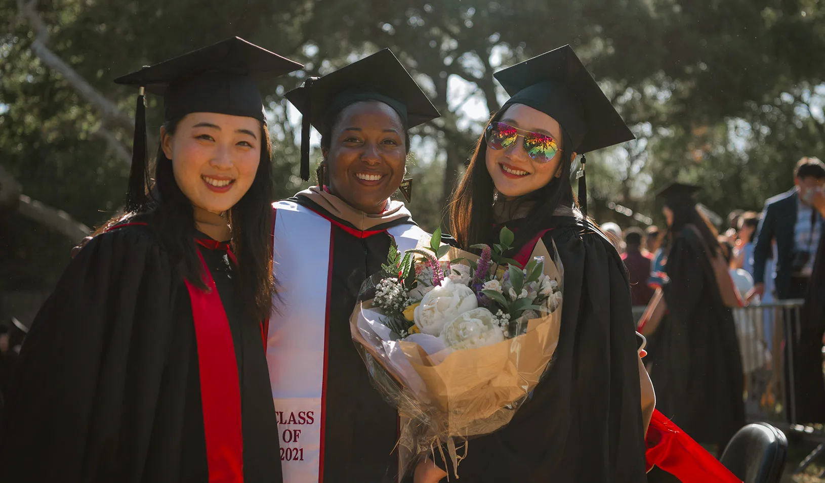MBA Students from Stanford GSB class of 2021 smiling during during their outdoor commencement celebration. | Credit: Saul Bromberger.
