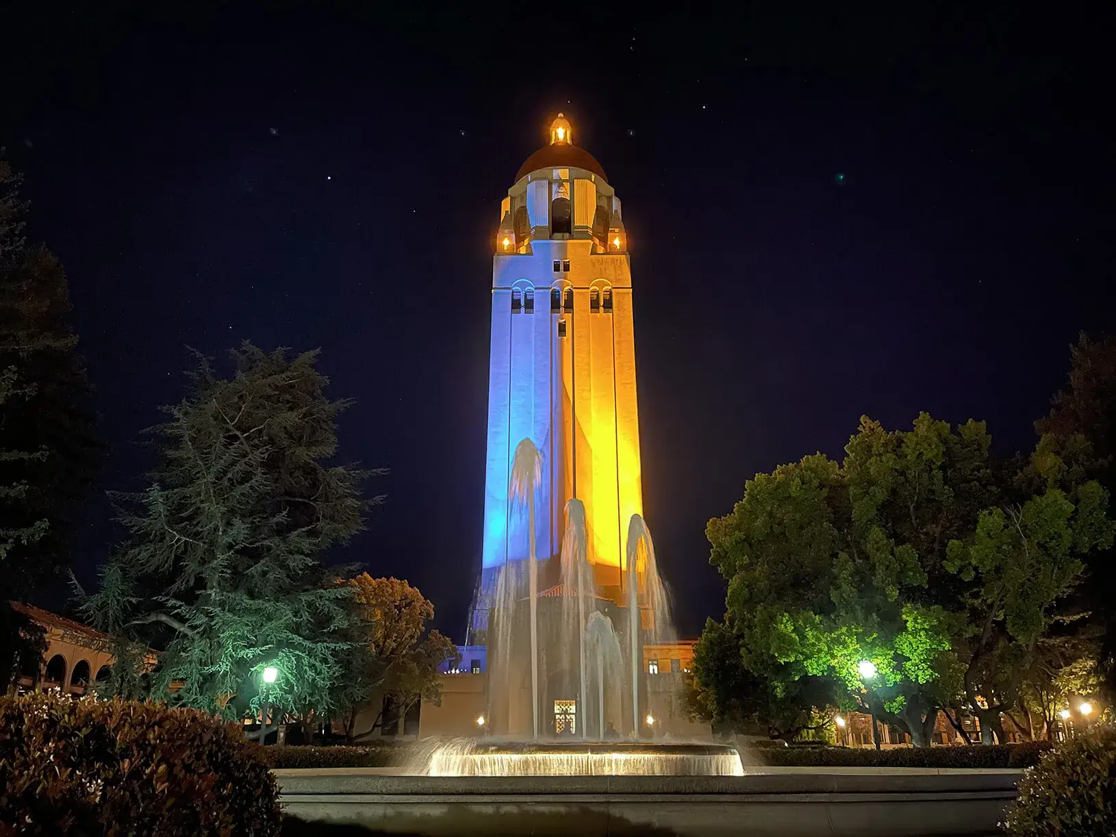 A photo of Hoover Tower lit with the Blue and Yellow colors of the Ukraine flag. | Credit: Photo courtesy Kate Slunkova.