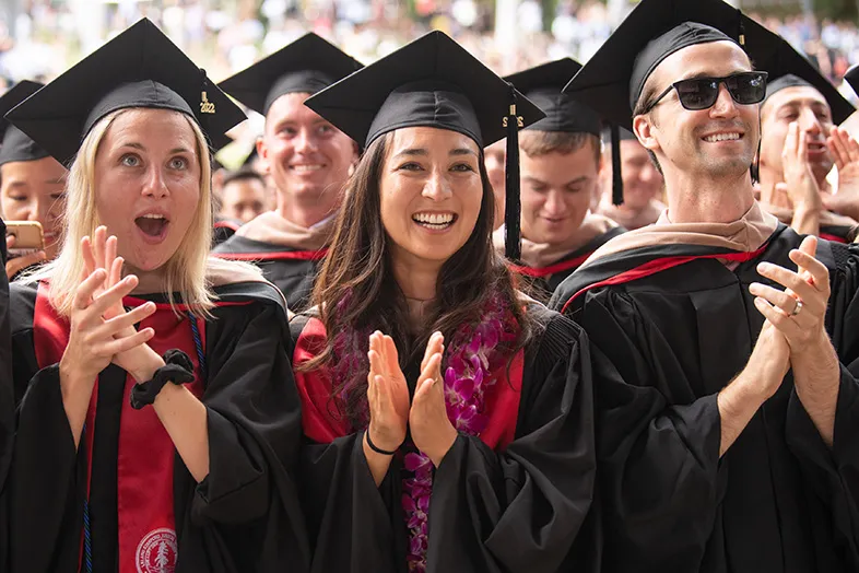 A group of three students looking excited during the commencement ceremony. Best Grad Photo Inc.