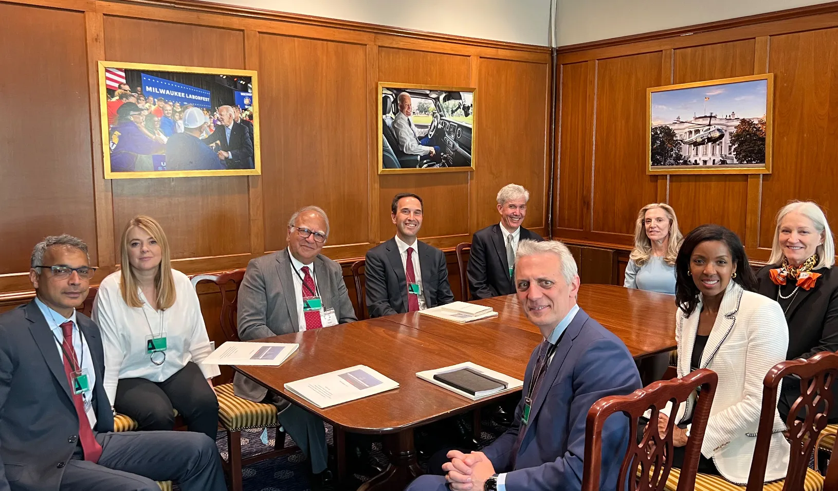 Photo of deans around a table in meeting with the director of the National Economic Council. Credit: By Courtesy