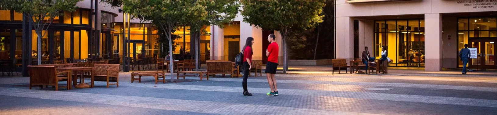 Two students standing in the middle of the GSB Quad