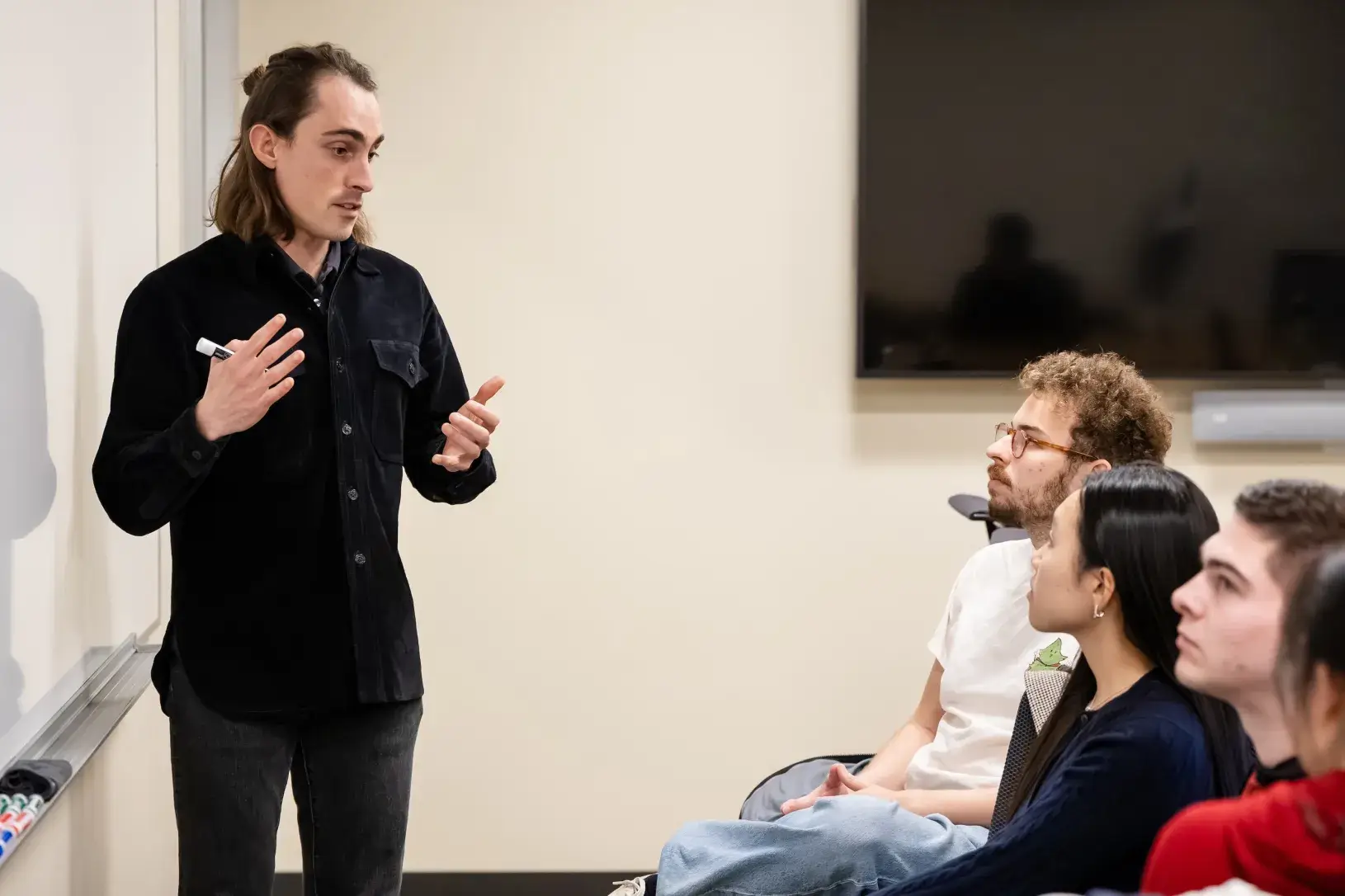 Phd students and professor in class