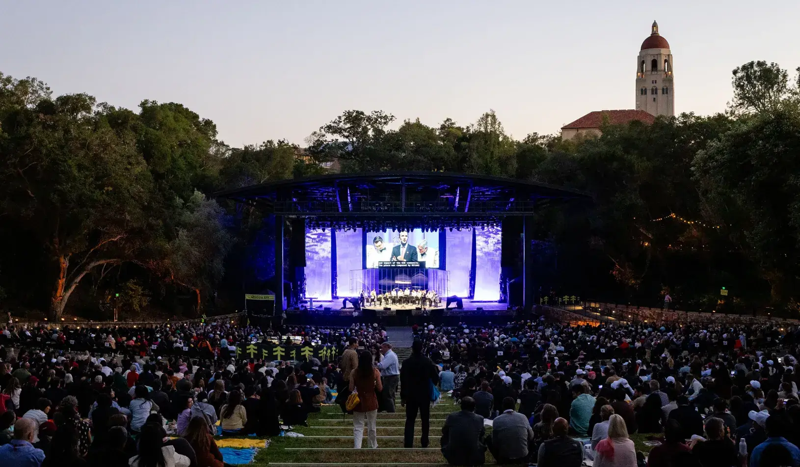 Centennial celebration at frost with hoover tower in the distance