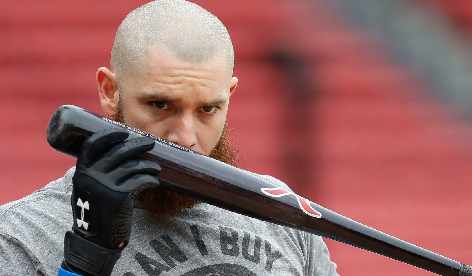 Red Sox left fielder Jonny Gomes kisses his bat during a team workout at Fenway Park, 2013 (USA Today Sports photo by Greg M. Cooper)