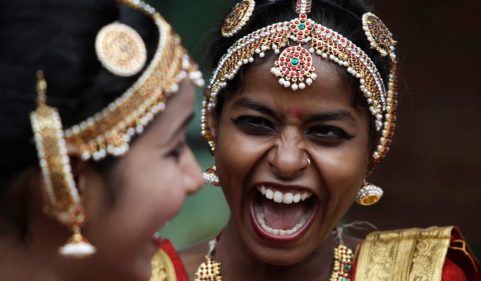 Two women smiling and laughing.