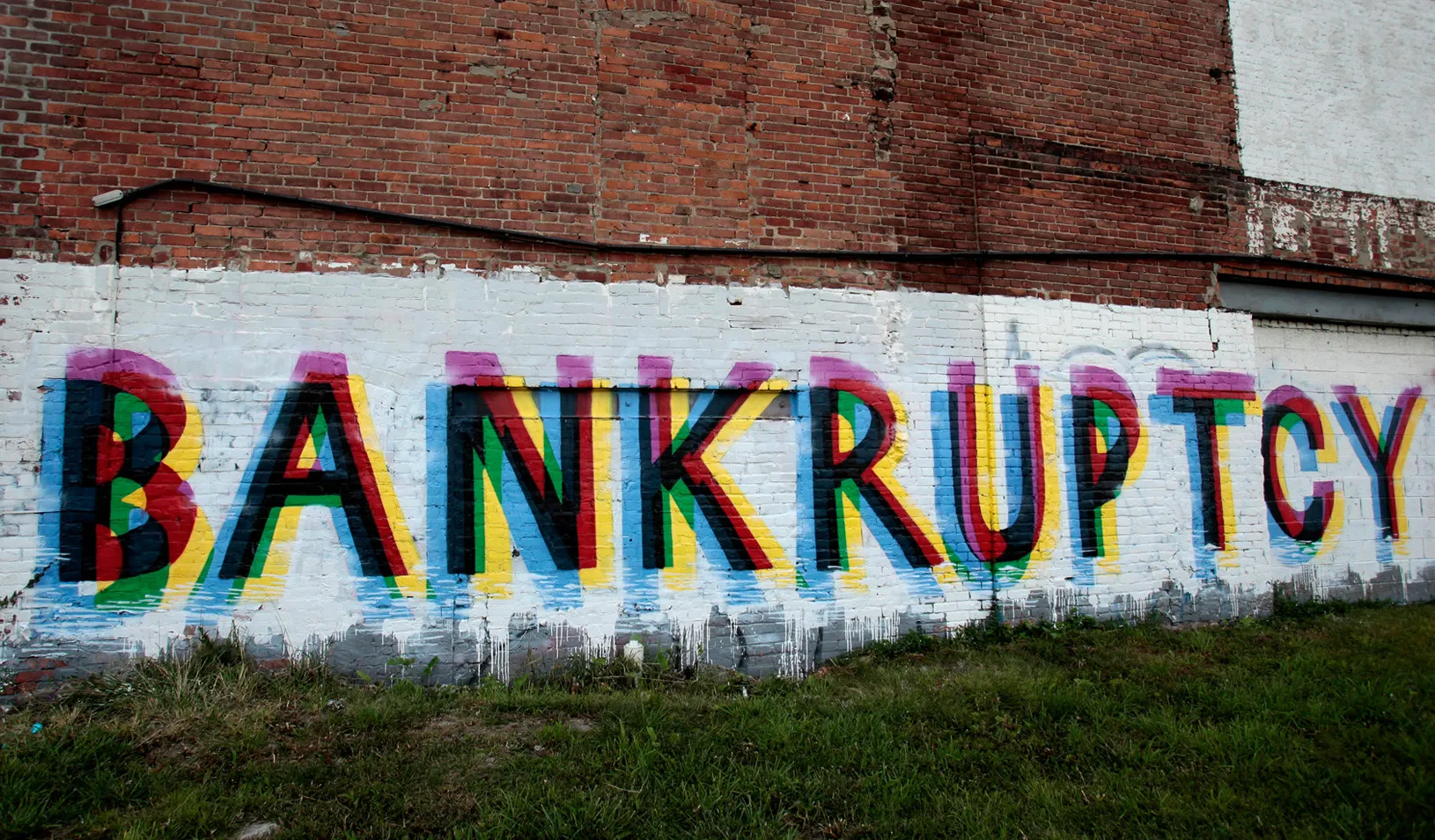 The word "Bankruptcy" painted on the side of a vacant Detroit building (Reuters photo by Rebecca Cook)