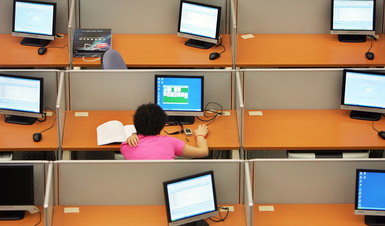 A trader plays a computer game in the trading room of the Shanghai Petroleum Exchange. | Reuters/Aly Song