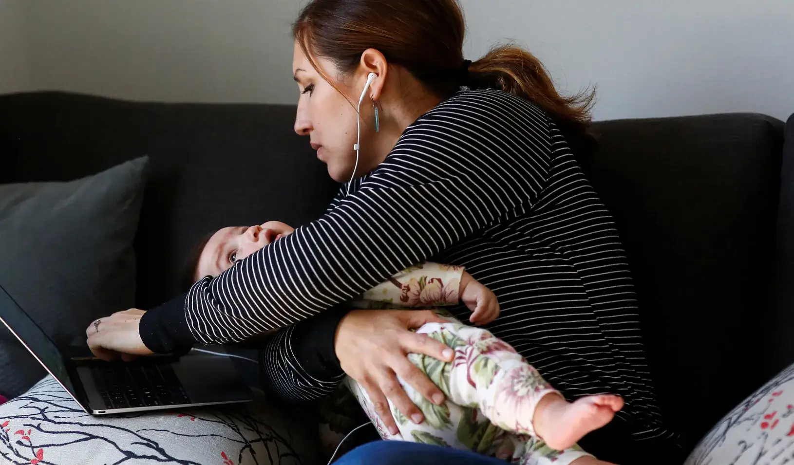 Seattle City Councilmember Teresa Mosqueda reaches over to check in to a council meeting by phone during the coronavirus disease (COVID-19) outbreak. March 23, 2020. Credit: Reuters/Lindsey Wasson Seattle City Council member 