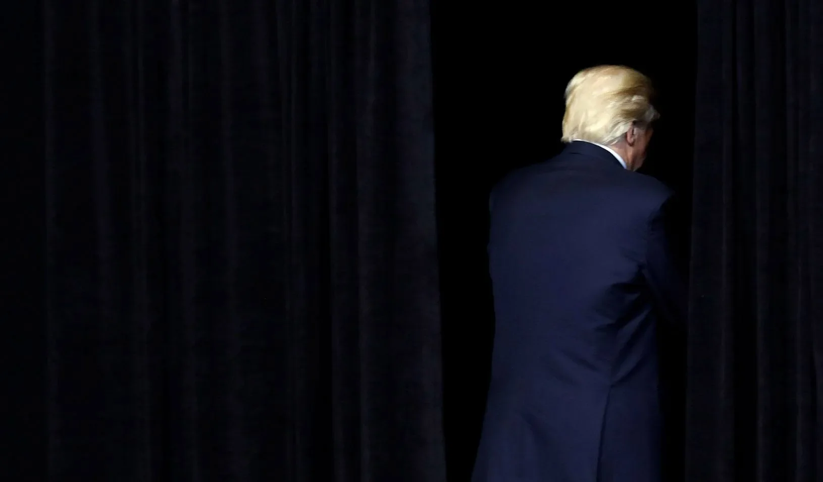 U.S. President Donald Trump exits the stage.
