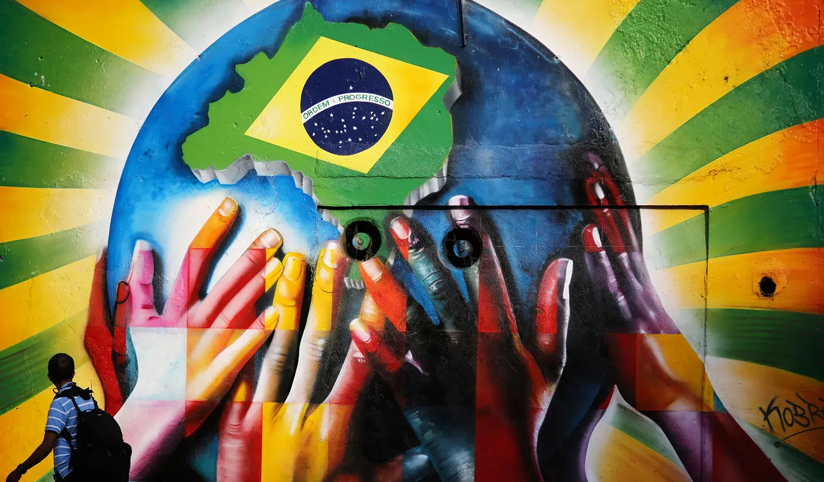 A man looking at graffiti  | Reuters/Nacho Doce