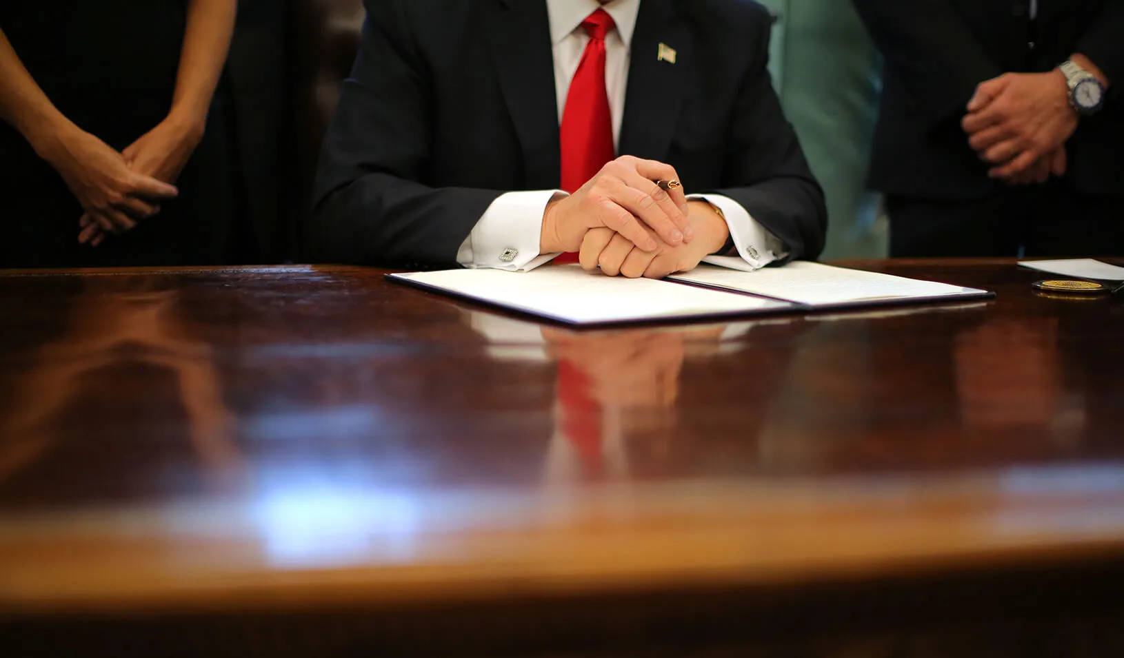 U.S. President Donald Trump at his desk in the Oval Office of the White House. | Reuters/Carlos Barria