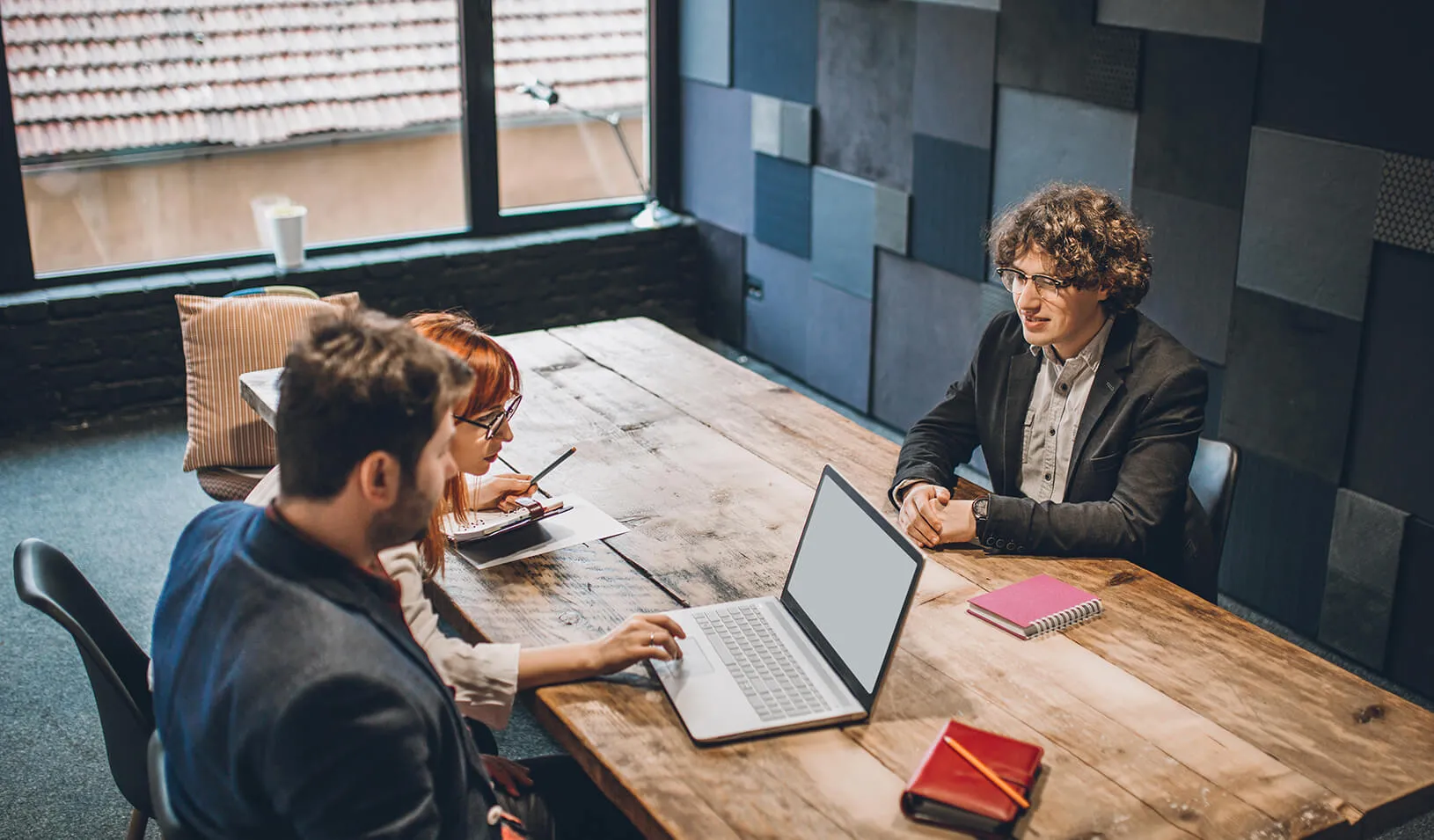 A young man is interviewed for a job | iStock/hobo_018