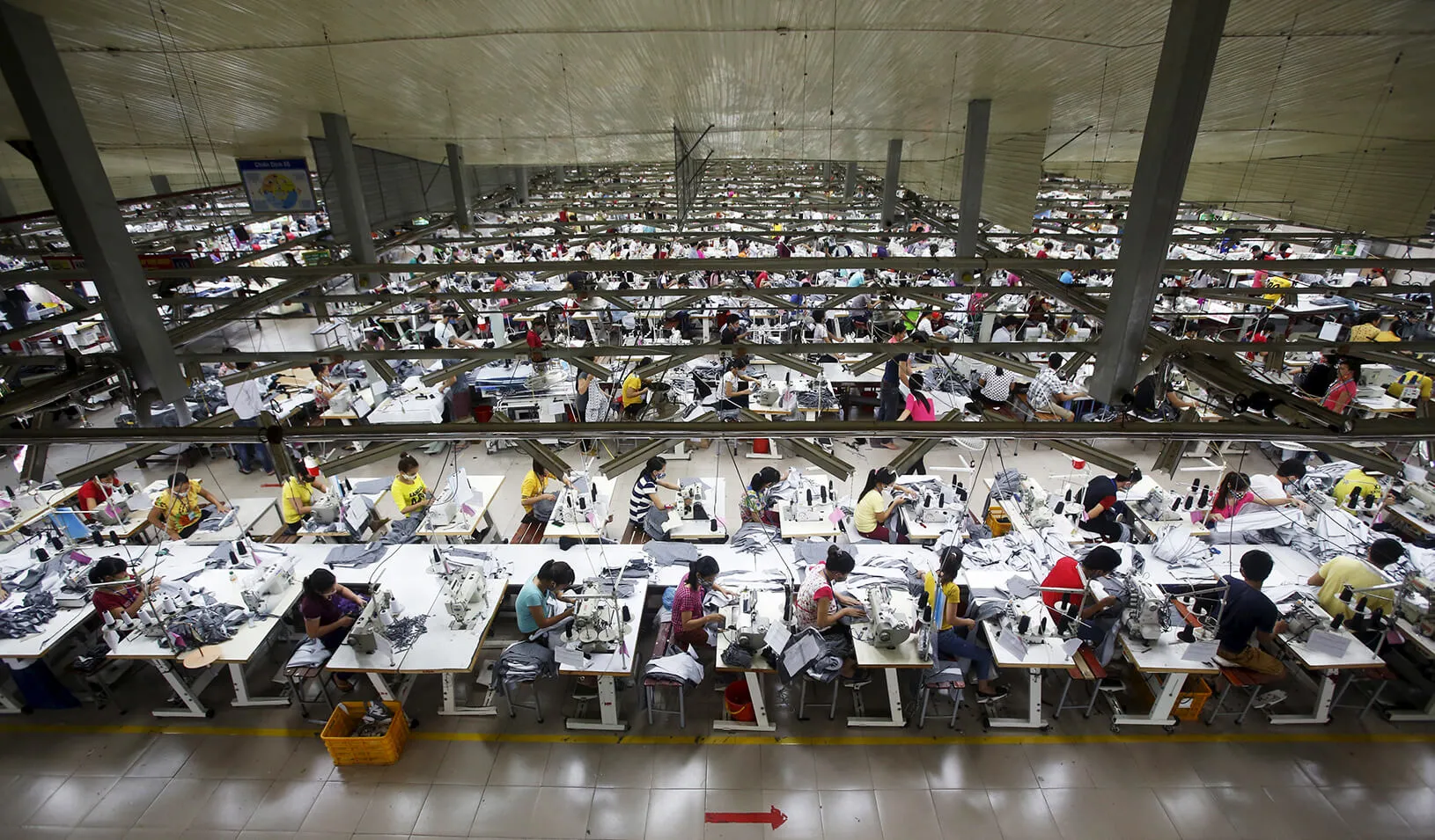 Labourers work at a large garment factory | Reuters/Kham