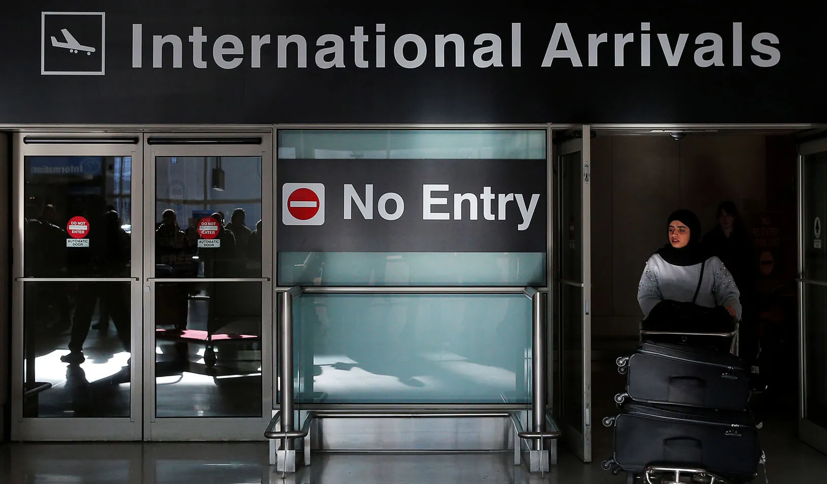 An international traveler arrives after U.S. President Donald Trump's executive order travel ban at Logan Airport in Boston, Massachusetts. | Reuters/Brian Snyder