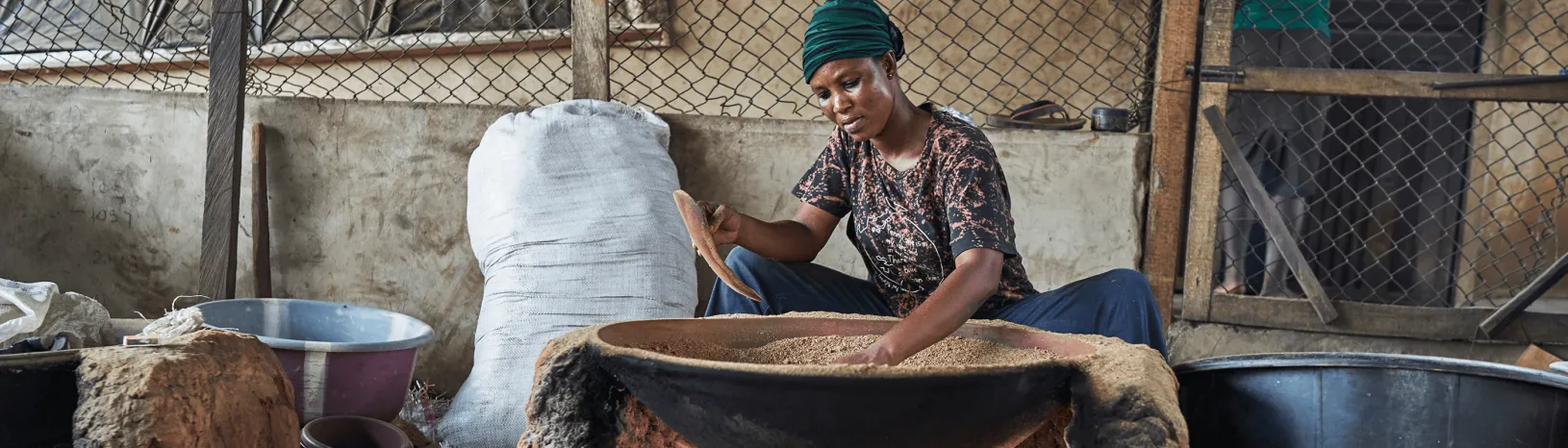 Woman working at Nation Feeders, a Seed company in West Africa.