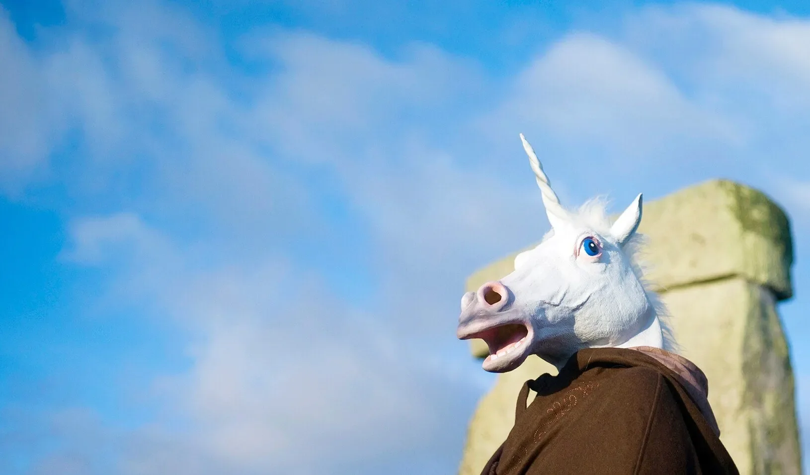 A reveller dressed as a unicorn. | Reuters/Kieran Doherty