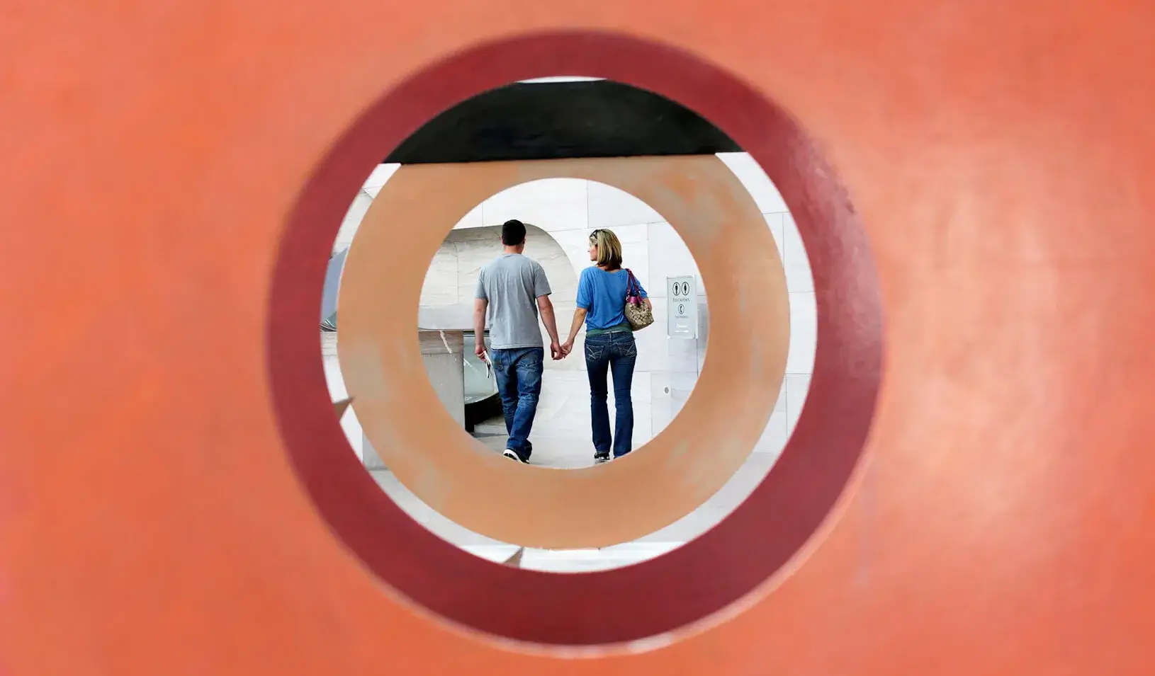 A couple holding hands, intent on each other | Reuters/Kevin Lamarque