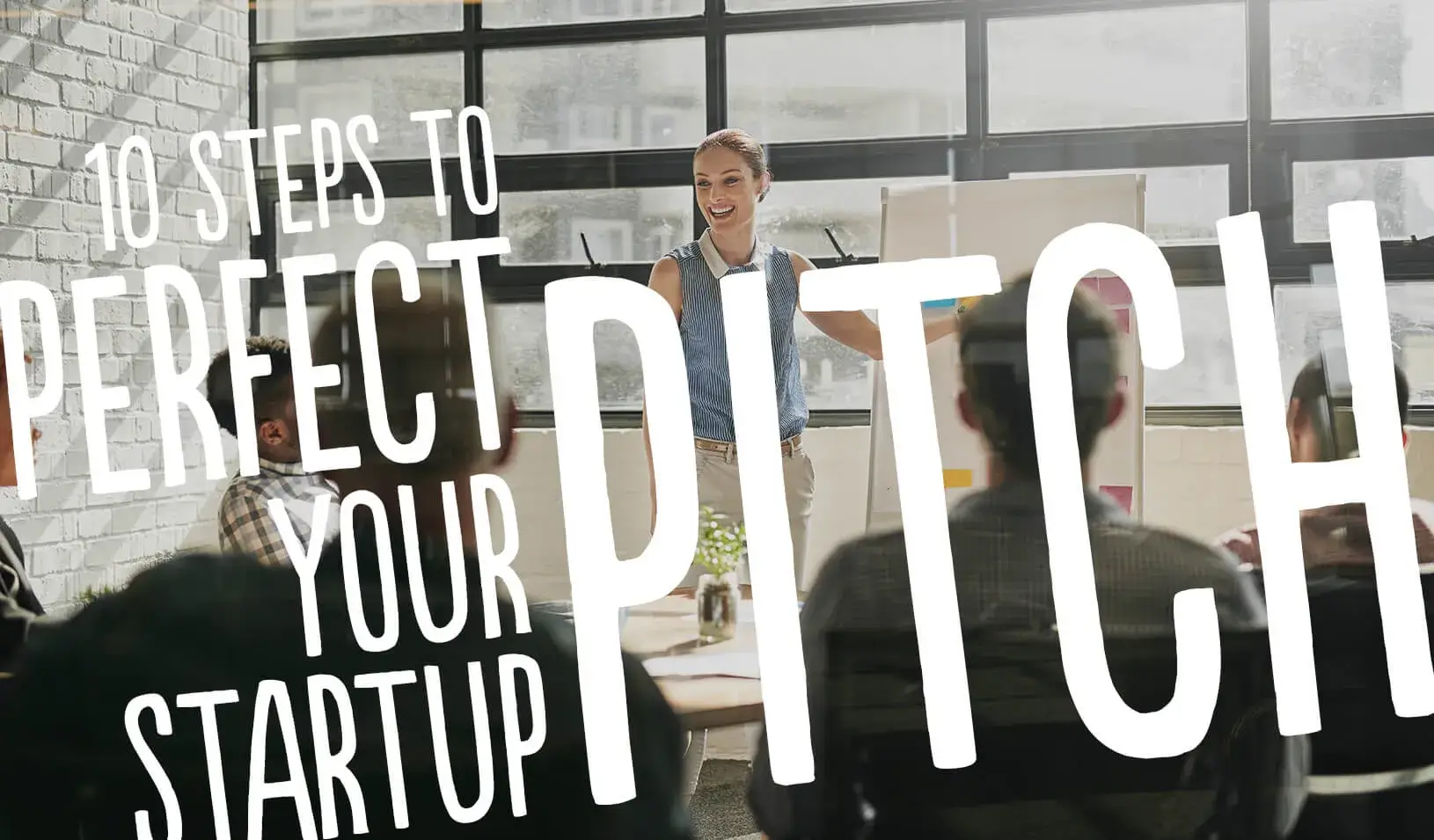 A woman presenting. 10 steps to Perfect your Startup Pitch | iStock/PeopleImages
