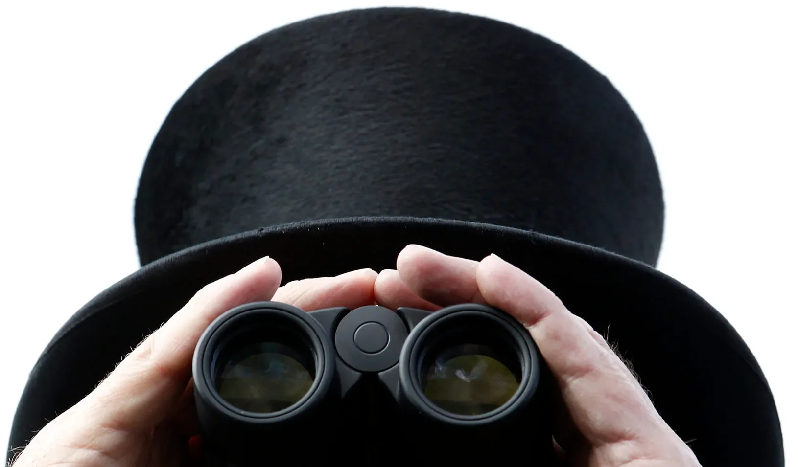 A man looks through binoculars | Reuters/Luke MacGregor