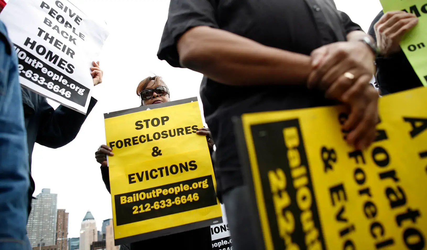 People protest outside the entrance for the Real Estate Disposition Corp Foreclosure Home Auction in New York, March 8, 2009. The auction of foreclosed homes in New York City on Sunday drew protesters who blamed banks for an epidemic of home losses and called for a moratorium on evictions and foreclosures. Credit: Reuters/Shannon Stapleton