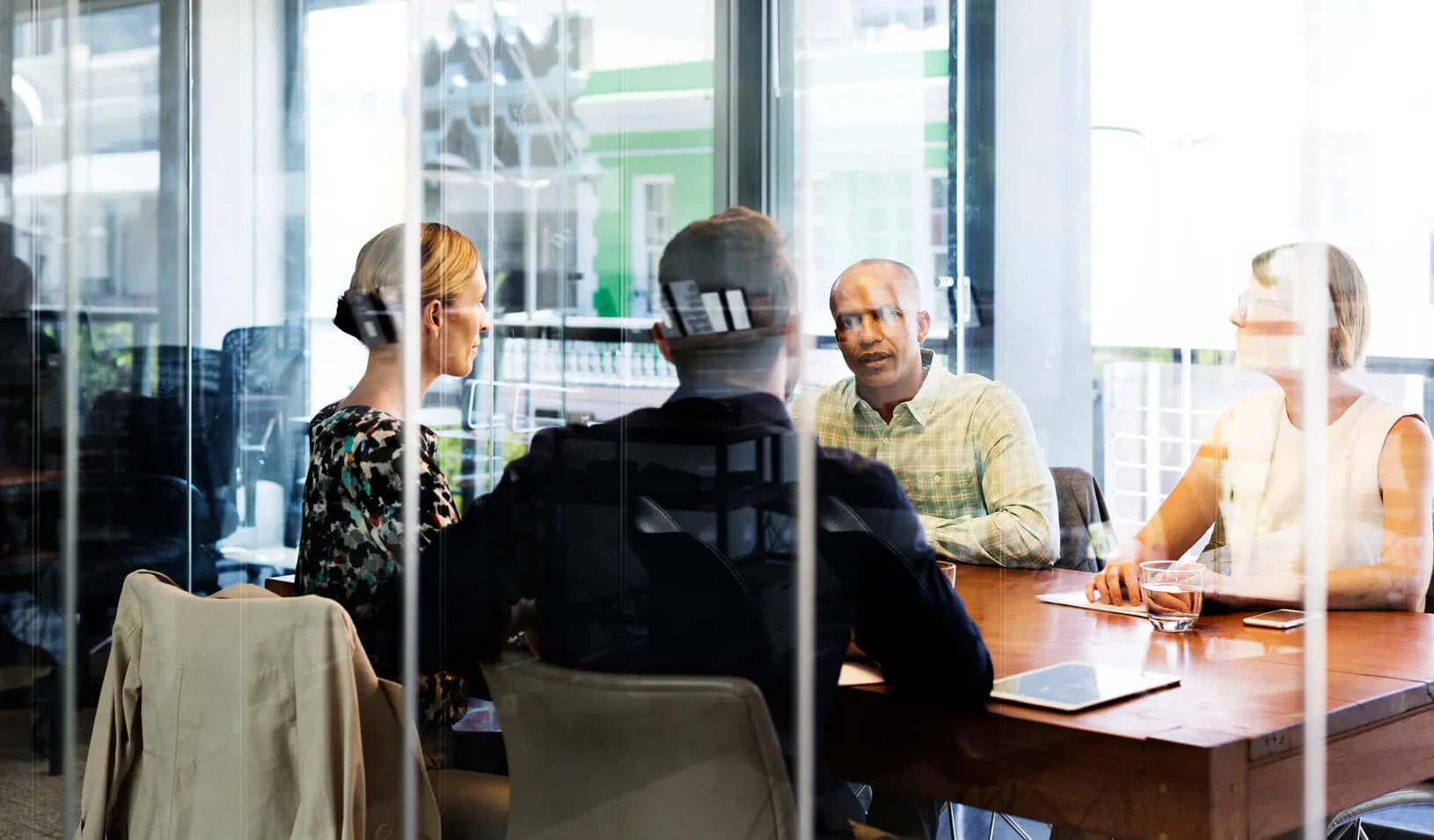 Business people in a board room. Credit: iStock/Morsa Images