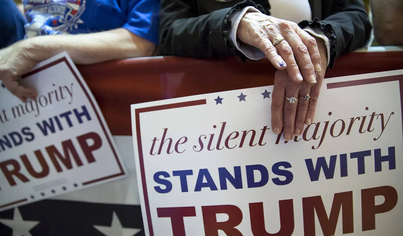 A supporter holds a sign for Republican presidential candidate Donald Trump | Reuters/Scott Morgan