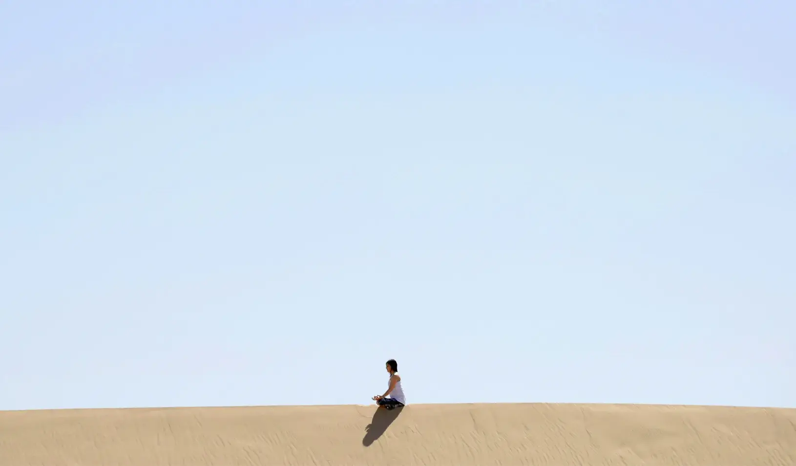 A yoga enthusiast rests after a class at the Samalayuca dunes, on the outskirts of Ciudad Juarez, Mexico. Credit: Reuters/Jose Luis Gonzalez