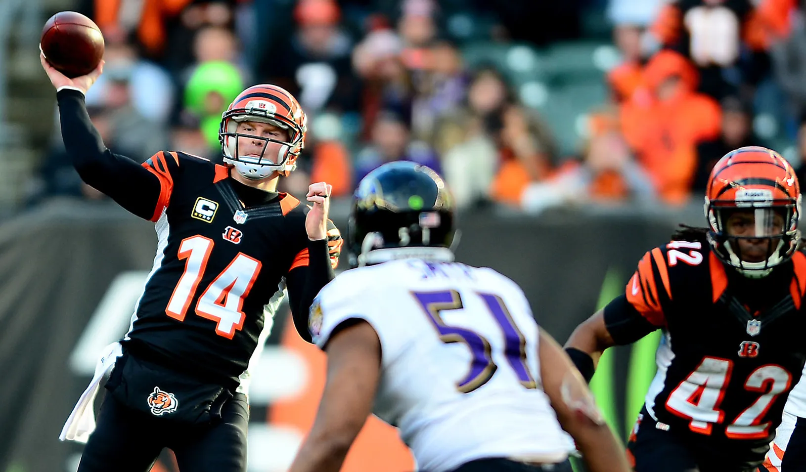 A football player throwing a Hail Mary pass.