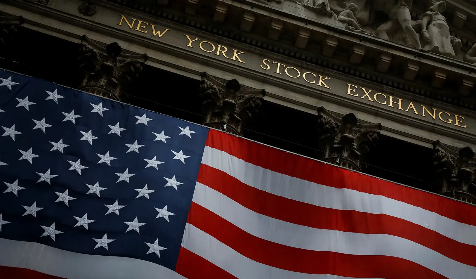 The New York Stock Exchange (NYSE) is seen in the financial district of lower Manhattan during the outbreak of the coronavirus disease in New York City. Credit: Reuters/Andrew Kelly