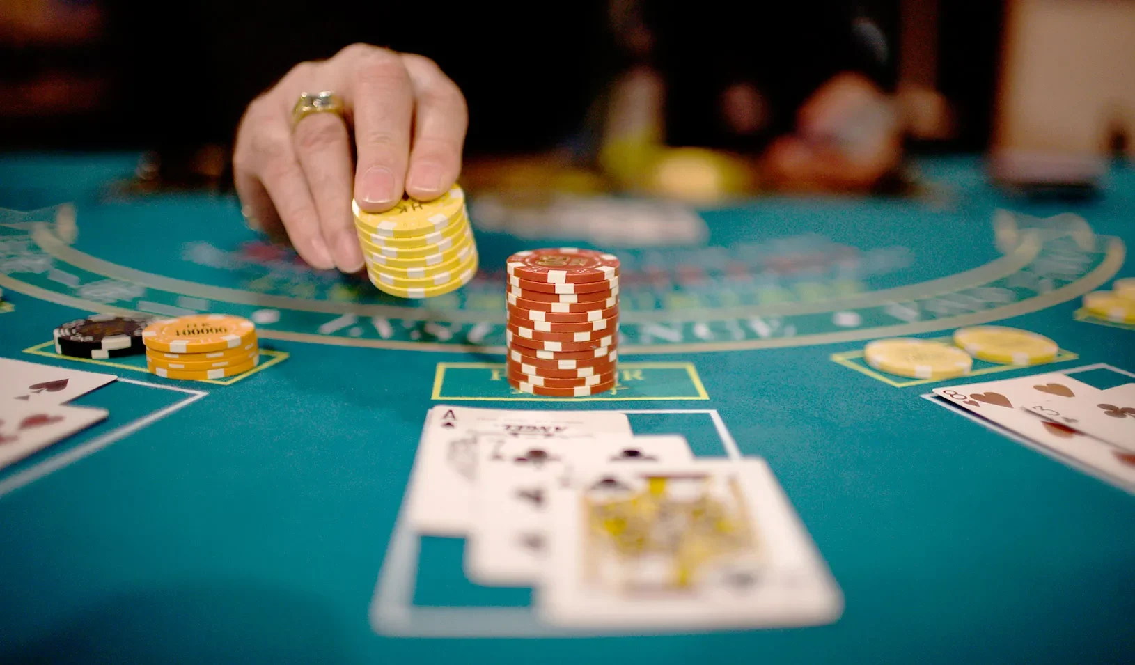Casino table with cards and chips | Reuters/Victor Fraile