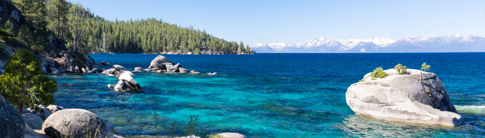 Sparkling Lake Tahoe lapping a rocky beach