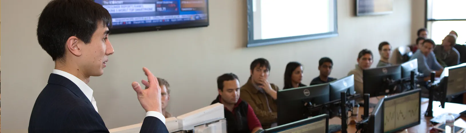 Professor Kevin Mak with students in the Real-time Investment Lab