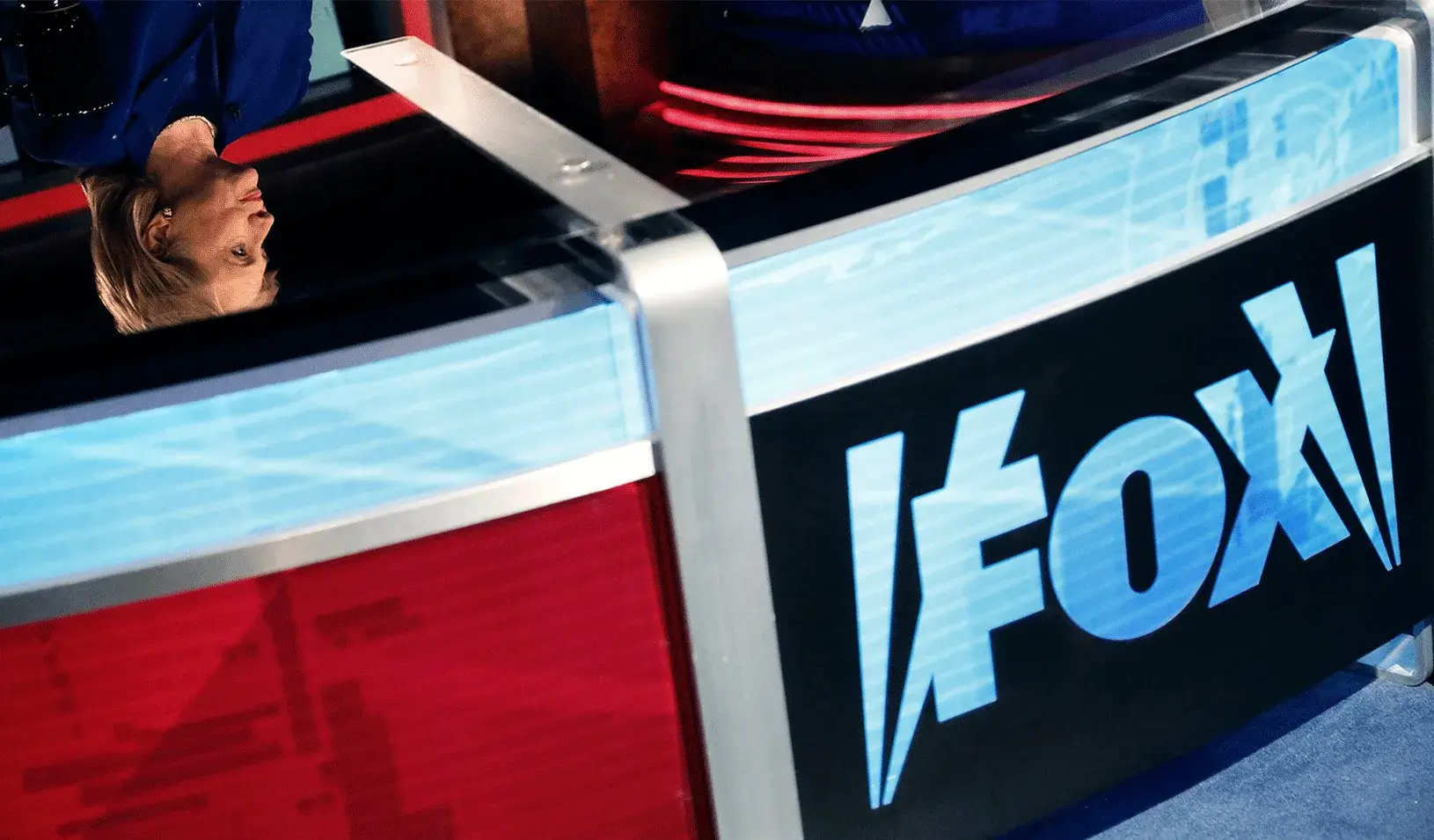 A reflection of Hillary Clinton on the Fox News interview desk. | Reuters/Jonathan Ernst
