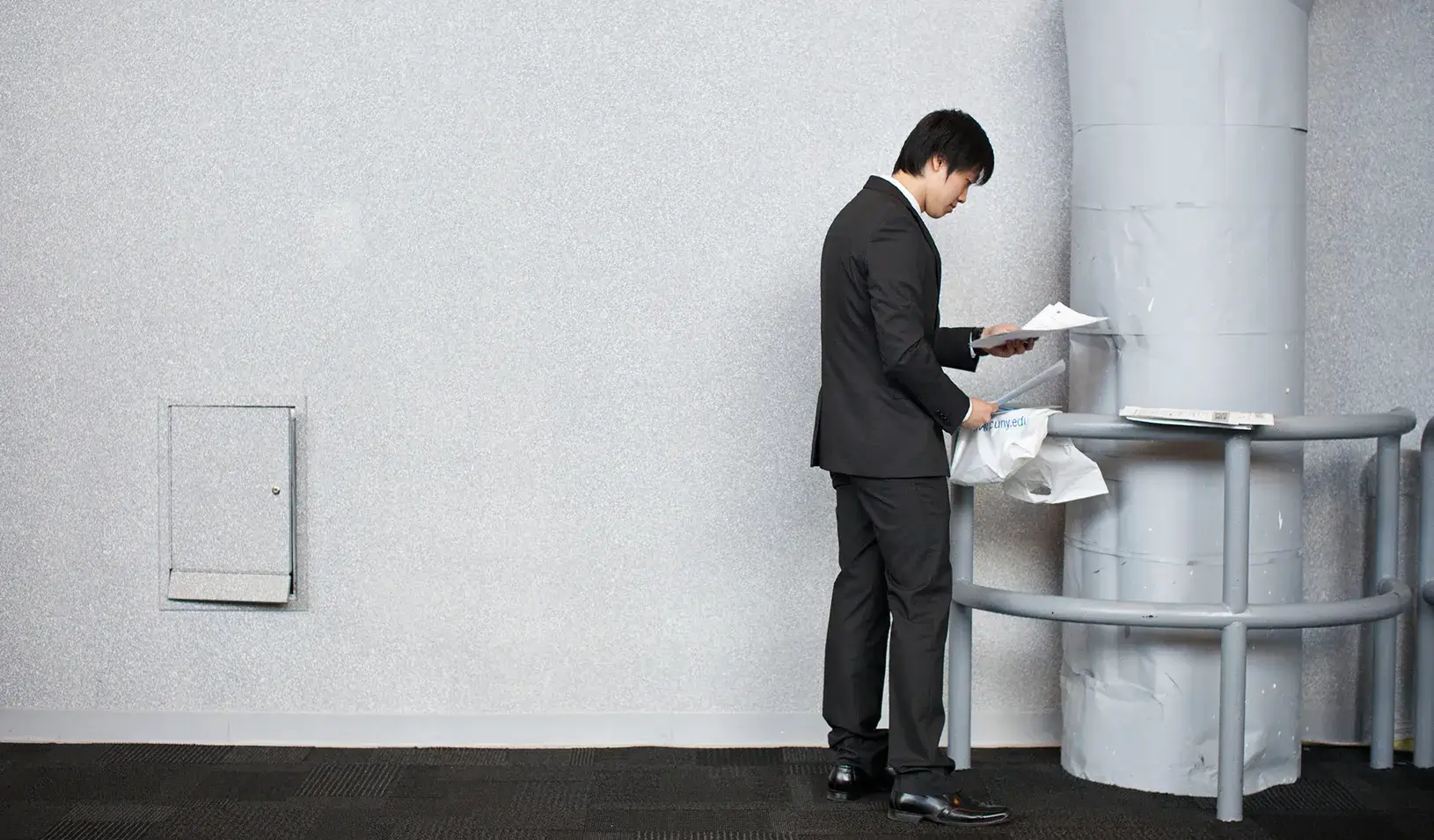 A man organizes his papers before meeting