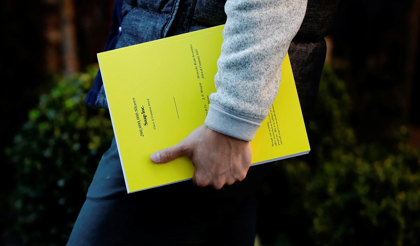 An investor holding a pamphlet of information on investing in the upcoming IPO of Snap Inc | Reuters/Lucas Jackson