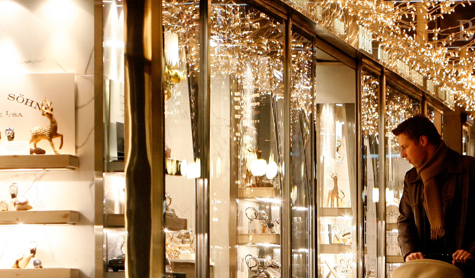 A man window shops during the holidays