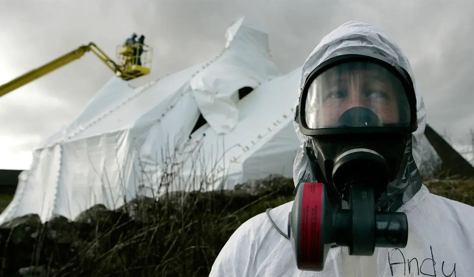 A man wearing protection in a decontamination scene | Reuters/David Moir