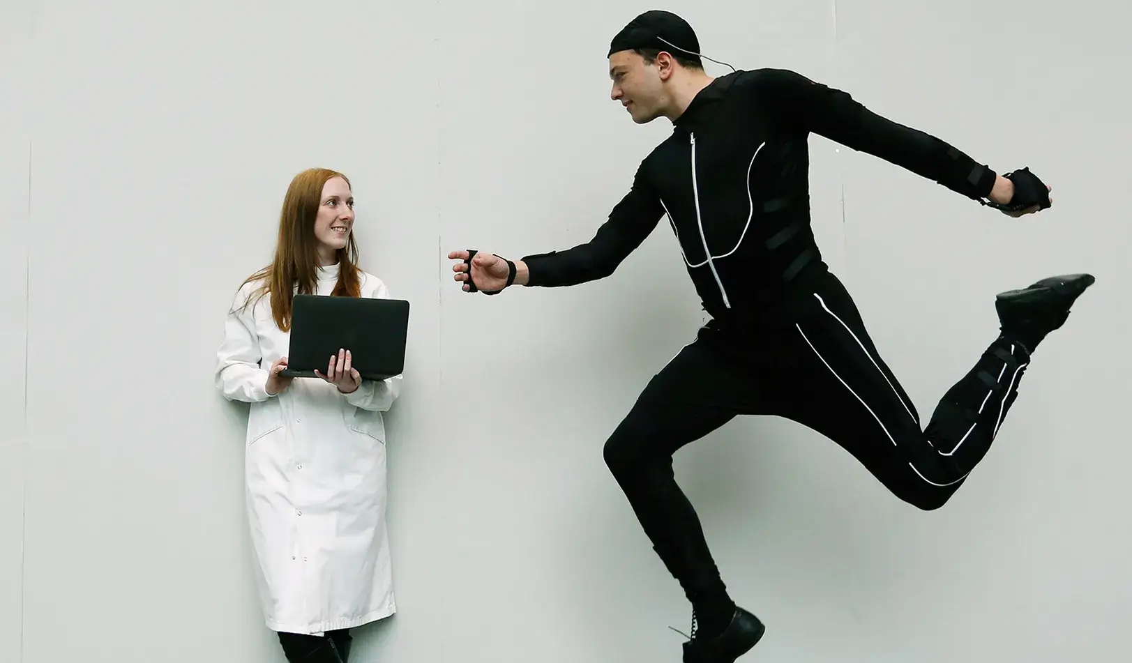 A researcher watching a participant jump during an experiment. | Reuters/Olivia Harris