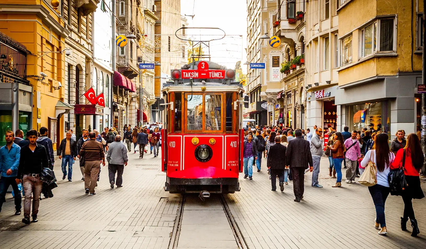 A streetcar makes it way alongside shoppers in Istanbul. | iStockPhoto/Yarygin