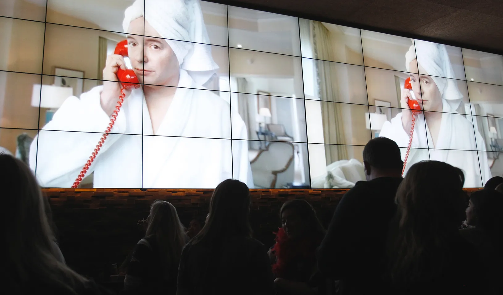 People watching tv screens. | Reuters/Jessica Rinaldi