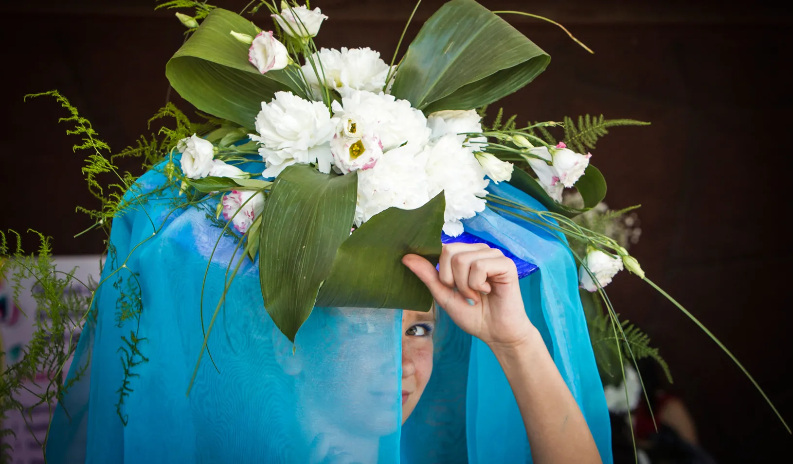 A model adjusts her outfit made of flowers as she attends a flower festival in Almaty May 24, 2014. REUTERS/Shamil Zhumatov (KAZAKHSTAN - Tags: SOCIETY) - RTR3QN15 (Reuters photo by Shamil Zhumatov)