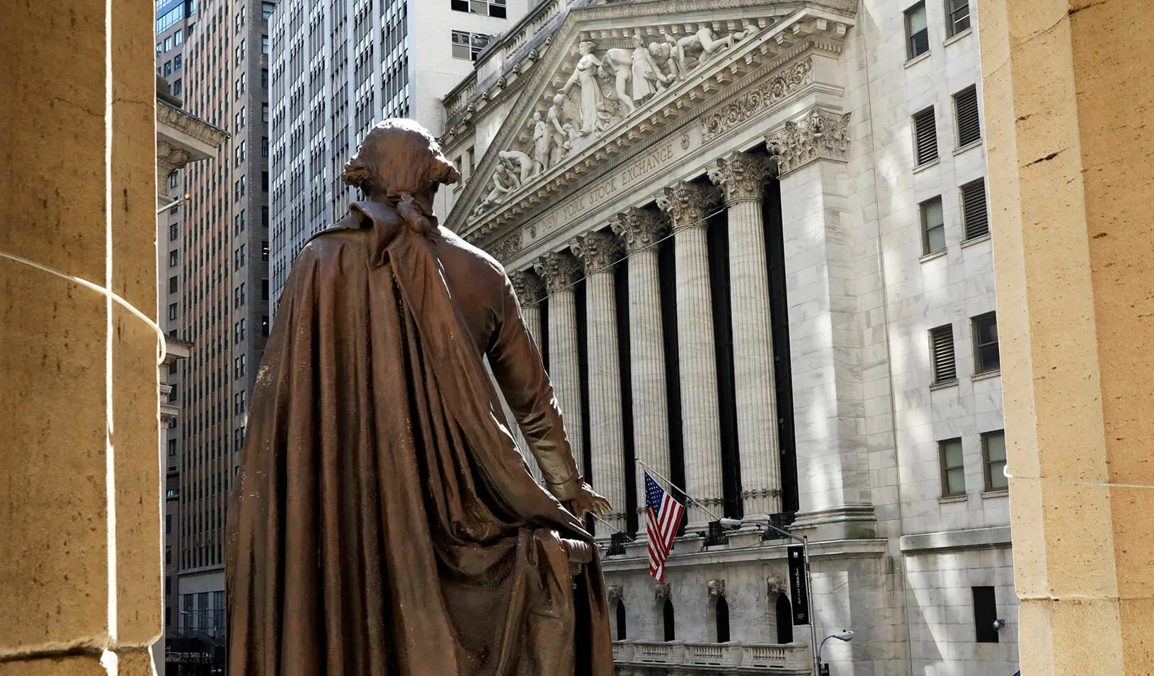 The New York Stock Exchange from the steps of Federal Hall behind a statue of former U.S. President George Washington 