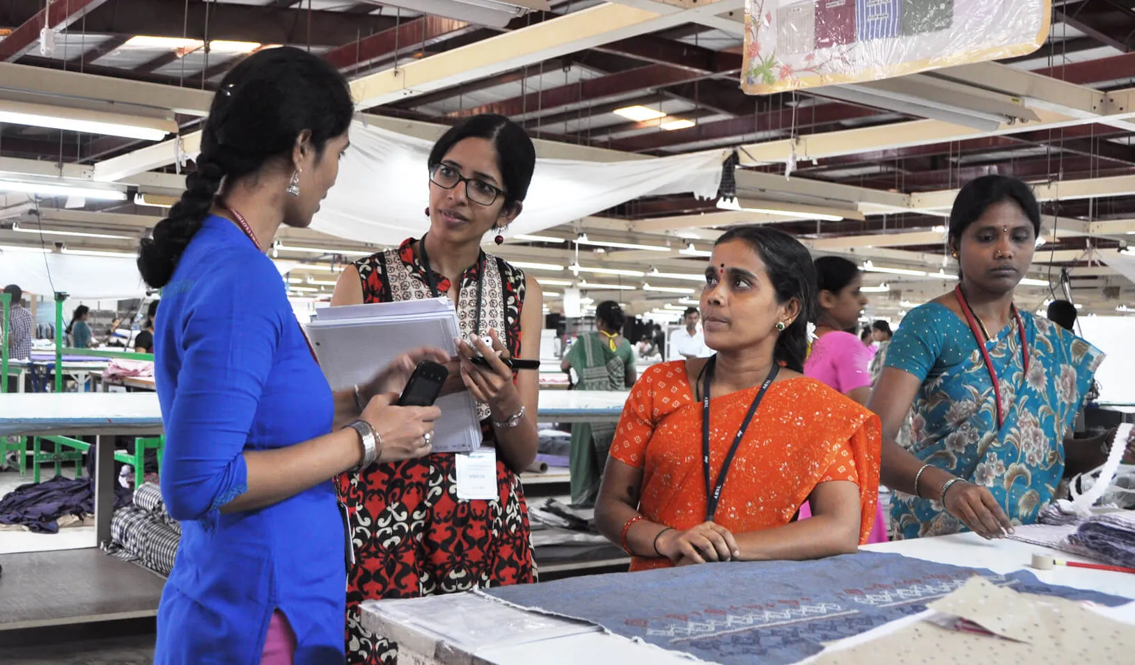 Professor Aruna Ranganathan with factory workers| Courtesy of Aruna Ranganathan
