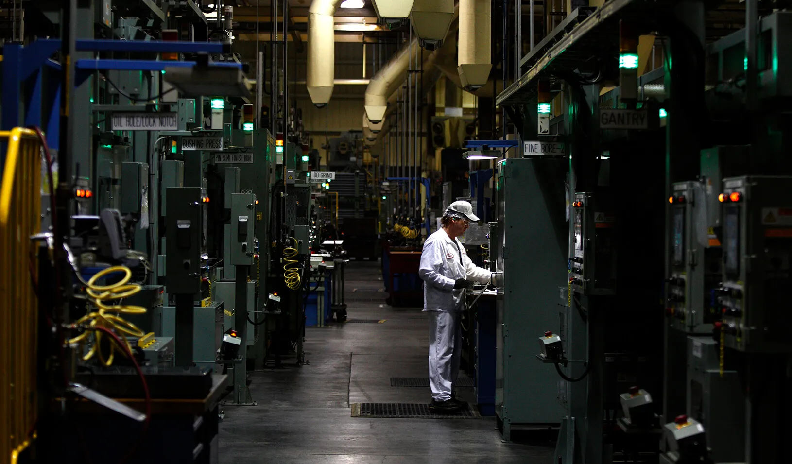 An associate is seen working at an automotive engine plant. Credit: Reuters/Paul Vernon