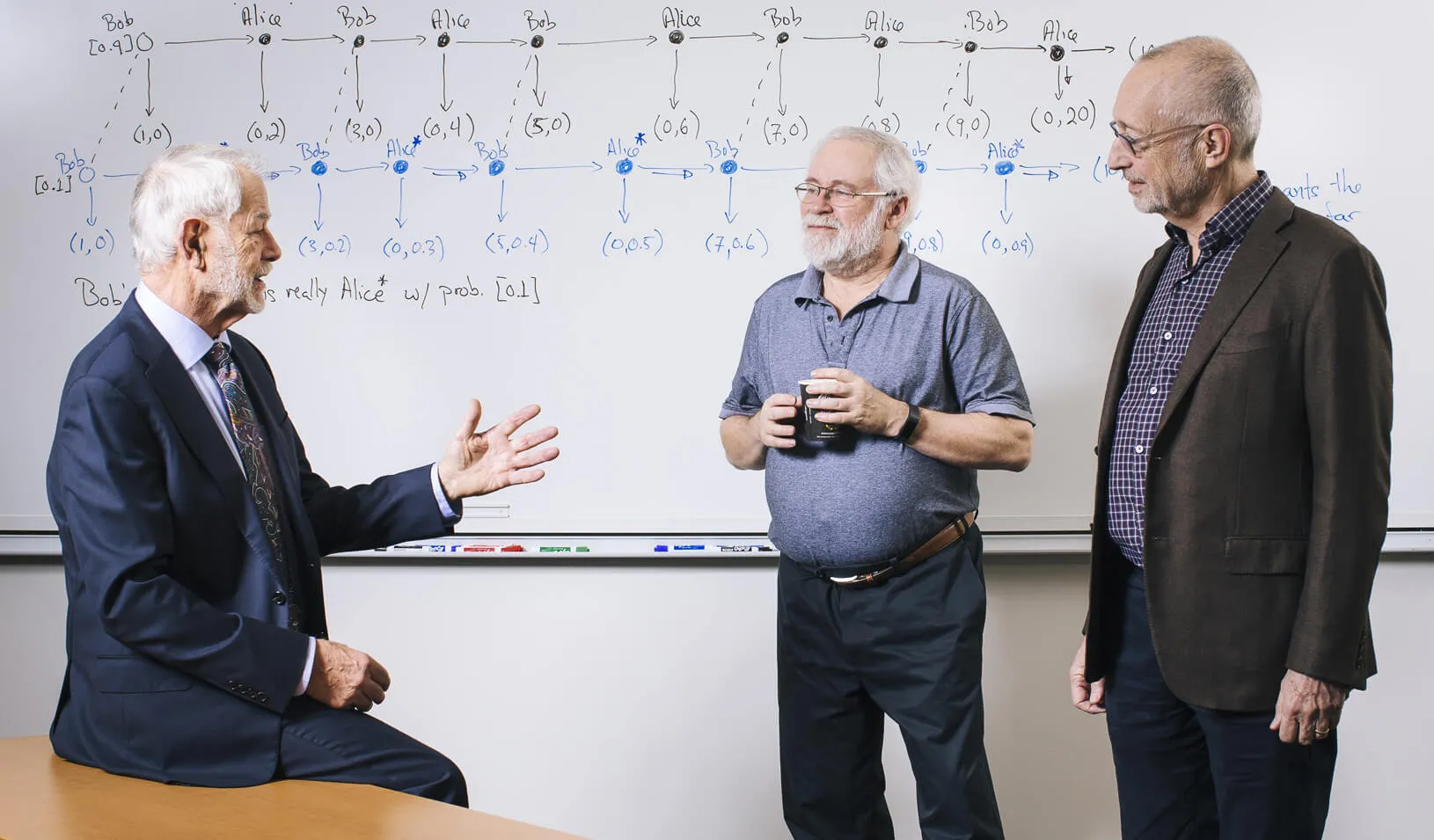 From left, Robert Wilson, David Kreps, and Paul Migrom, received the 2018 John J. Carty Award in the field of economics. | Elena Zhukova
