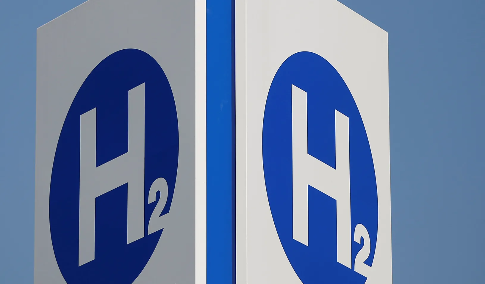 Hydrogen chemical symbols are displayed on a sign at a hydrogen station. Credit: Reuters/Issei Kato