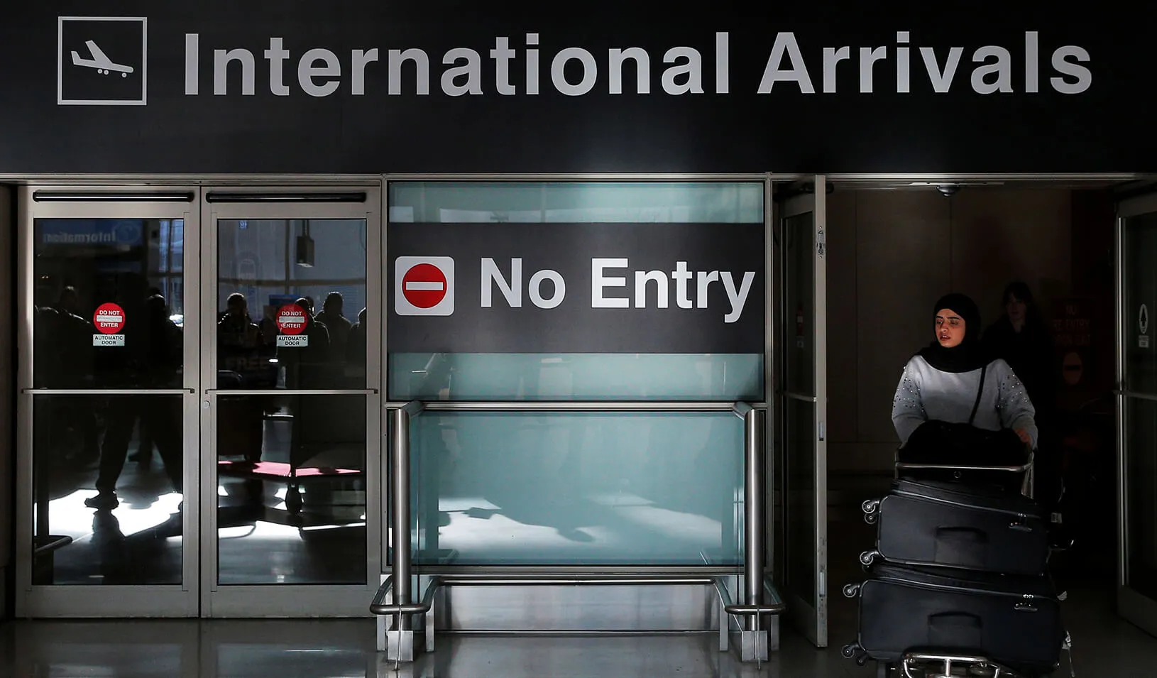 An international traveler arrives after U.S. President Donald Trump's executive order travel ban at Logan Airport in Boston, Massachusetts.