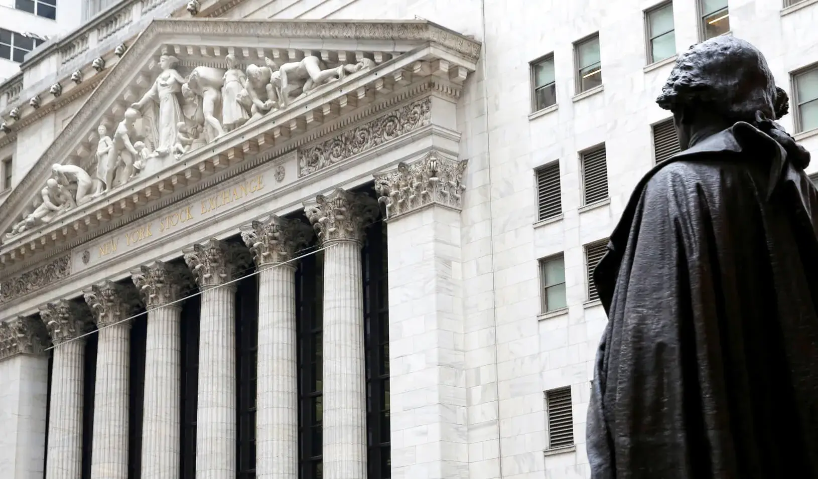 A statue of George Washington stands across from the New York Stock Exchange in Manhattan, New York City. Credit: Reuters/Andrew Kelly
